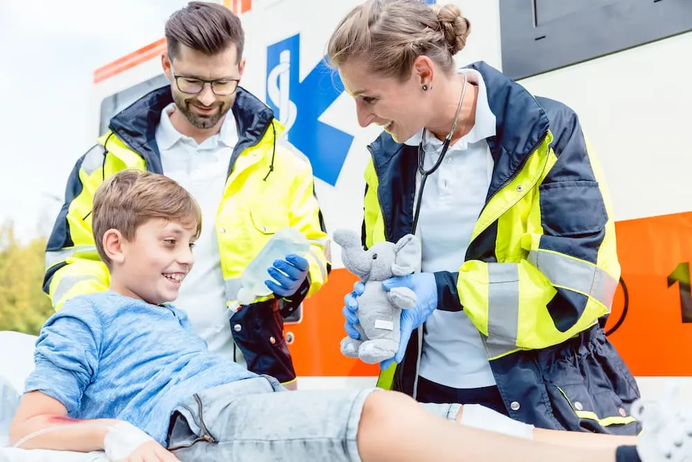 First Aid Training Paramedics Treating Boy